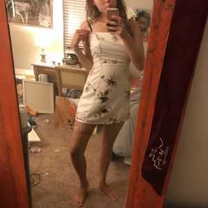 White floral body con dress with pink flowers